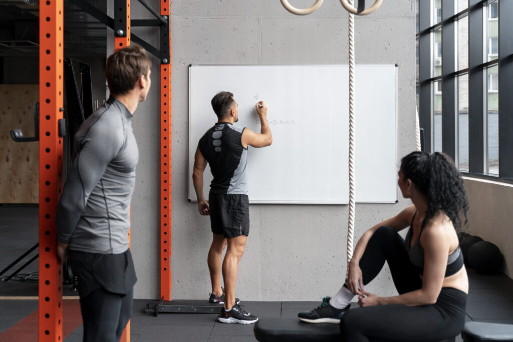 people gym talking making exercise plans