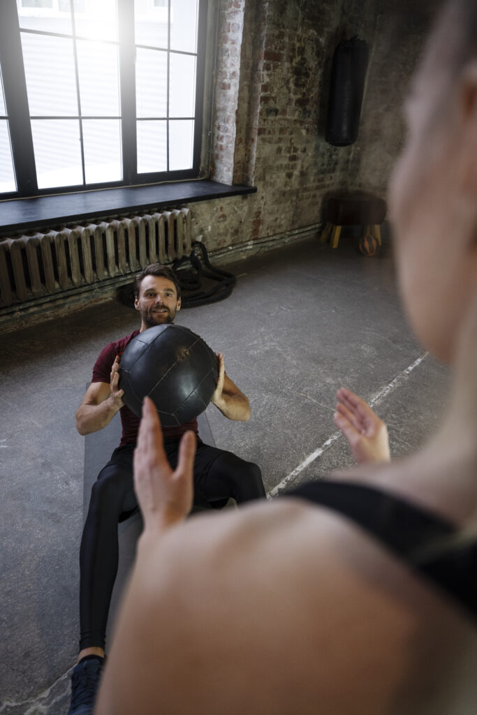 people training together with gym ball